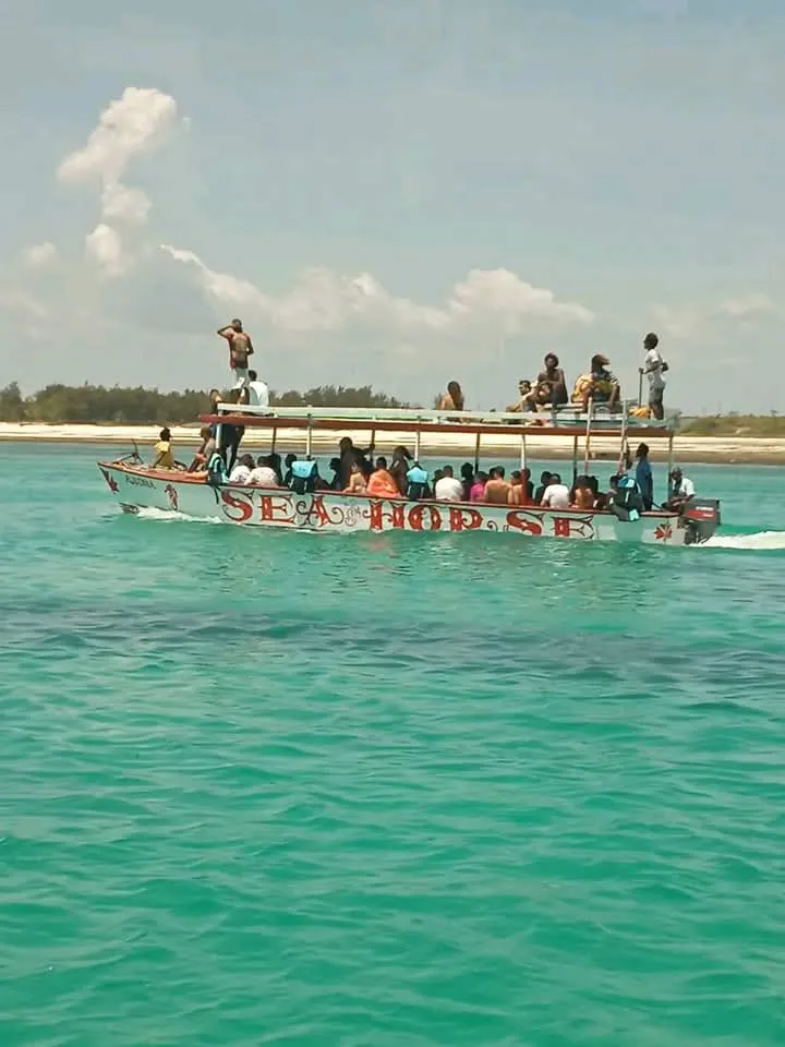 Boat outing on turquoise water during a Mombasa tours sandbank and marine excursion