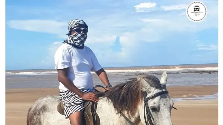 Traveler riding a horse on the beach during a Mombasa tours coastal excursion
