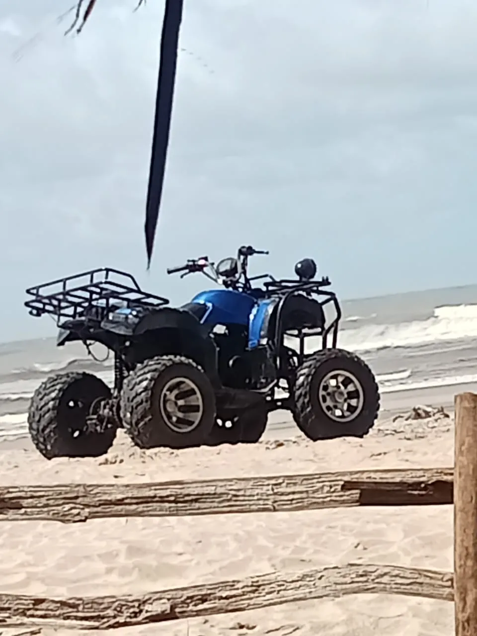 Quad bike parked on the shoreline for an active Mombasa tours beach adventure